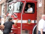 firemen finish pushing the engine